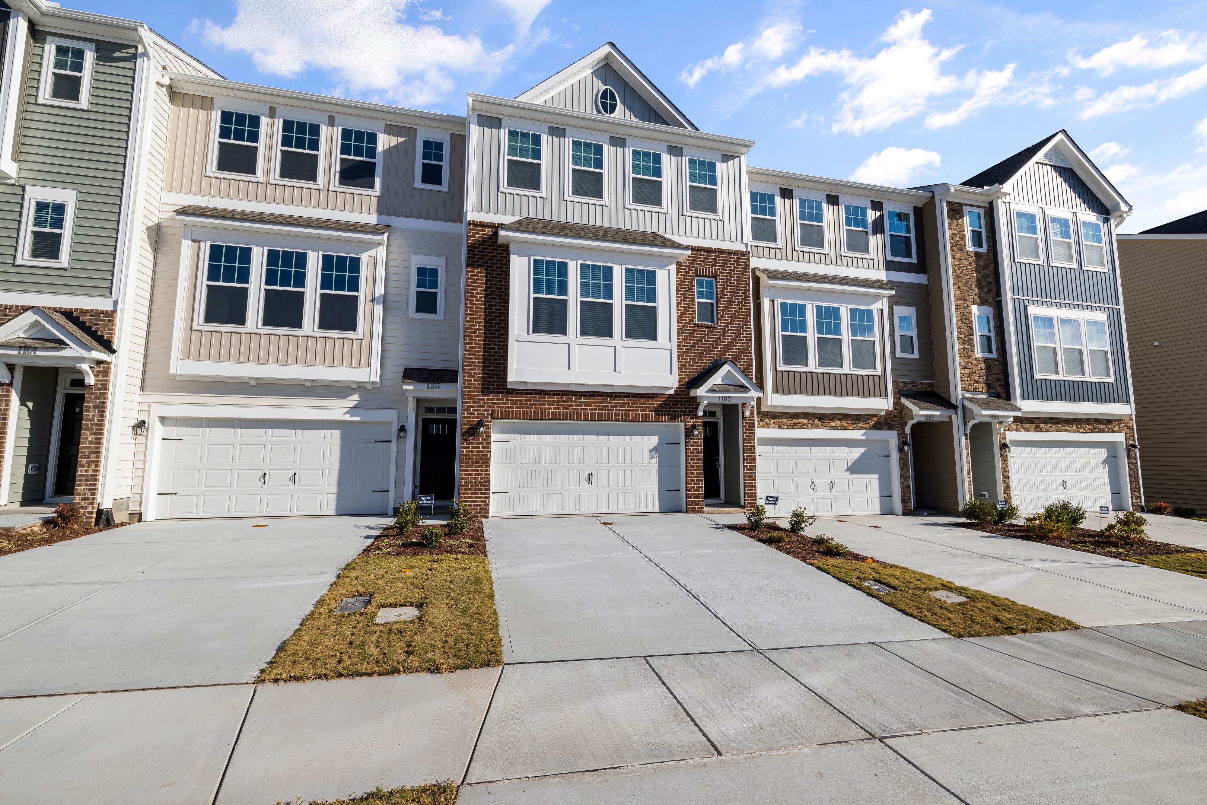 Coordinated homes using varied exterior materials and colors